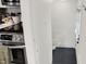 An open hallway featuring an oven with stainless steel appliances at 5015 Carrollton Ave, Indianapolis, IN 46205