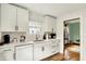 Bright kitchen featuring white cabinets, quartz countertops and stainless steel appliances at 5015 Carrollton Ave, Indianapolis, IN 46205