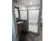 This bathroom features a vanity with granite countertop and a shower with glass doors at 5043 Harway Ct, Indianapolis, IN 46227