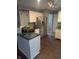 The kitchen features white cabinets, stainless appliances, and an island with updated counters at 5043 Harway Ct, Indianapolis, IN 46227