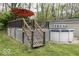 Backyard featuring a deck, above ground pool, and detached garage at 5137 Green Hills Dr, Brownsburg, IN 46112