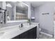 A clean bathroom featuring a sleek black vanity and neutral decor at 5137 Green Hills Dr, Brownsburg, IN 46112
