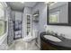 Bathroom featuring a shower, modern vanity, and large window at 5137 Green Hills Dr, Brownsburg, IN 46112