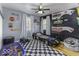 A bedroom with race car bed and racing memorabilia displayed at 5137 Green Hills Dr, Brownsburg, IN 46112