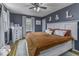 Bedroom with gray walls, white dresser and accents and a comfy queen bed at 5137 Green Hills Dr, Brownsburg, IN 46112