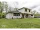 A lovely home with painted brick, a manicured lawn, and a cozy front porch, offering great curb appeal at 5137 Green Hills Dr, Brownsburg, IN 46112