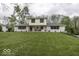 Charming two-story home featuring a manicured lawn, painted brick, and inviting front porch at 5137 Green Hills Dr, Brownsburg, IN 46112