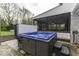 Outdoor hot tub with adjacent screened-in porch at 5137 Green Hills Dr, Brownsburg, IN 46112