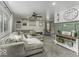 Bright and spacious living room featuring a large sectional couch, stylish decor, and ample natural light at 5137 Green Hills Dr, Brownsburg, IN 46112