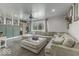 Comfortable living area with a large sectional couch, accent wall, and inviting natural light from windows at 5137 Green Hills Dr, Brownsburg, IN 46112
