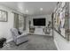 Cozy living room featuring an accent chair, entertainment center, and stylish decor, perfect for relaxation at 5137 Green Hills Dr, Brownsburg, IN 46112
