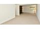 Partially finished basement featuring a brick fireplace, carpeted floors, and natural light at 5225 Elderberry Rd, Noblesville, IN 46062