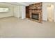 Spacious finished basement features neutral carpet, fireplace, and bright lighting from the window at 5225 Elderberry Rd, Noblesville, IN 46062