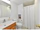 Bathroom featuring a vanity, toilet, and shower with white shower curtain and linen closet above toilet at 5225 Elderberry Rd, Noblesville, IN 46062
