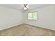 Bright, carpeted bedroom with a window, offering natural light and a cozy atmosphere at 5225 Elderberry Rd, Noblesville, IN 46062