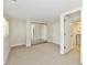Bedroom offers neutral carpet, mirrored closet doors, and access to the laundry area at 5225 Elderberry Rd, Noblesville, IN 46062