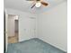 Bedroom featuring a ceiling fan, carpet, and closet space, offering a versatile and comfortable area at 5225 Elderberry Rd, Noblesville, IN 46062