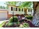 Inviting split-level home with mature trees and attractive landscaping, including a bench and bistro set at 5225 Elderberry Rd, Noblesville, IN 46062