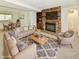 A bright living room with fireplace, comfortable seating, and an adjacent dining area creates an inviting space at 5225 Elderberry Rd, Noblesville, IN 46062