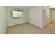 Spacious living area featuring carpeted floors and ample natural light, ideal for entertaining at 5225 Elderberry Rd, Noblesville, IN 46062
