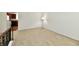 Bright loft with neutral carpet offers a view into the kitchen at 5225 Elderberry Rd, Noblesville, IN 46062