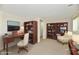Office with desk, bookcases, and a comfortable reading chair provides an inspiring workspace at 5225 Elderberry Rd, Noblesville, IN 46062