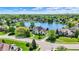 Picturesque aerial view of a home near a tranquil lake in a lush neighborhood at 5521 Salem N Dr, Carmel, IN 46033