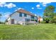 A beautiful backyard and spacious lawn on a sunny day with blue skies at 5521 Salem N Dr, Carmel, IN 46033