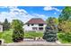 Beautiful backyard with well-manicured lawn, lake access, and mature trees offers a serene outdoor space at 5521 Salem N Dr, Carmel, IN 46033