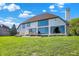 Well-manicured backyard with a large grassy area leading to the water at 5521 Salem N Dr, Carmel, IN 46033