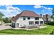 Large backyard featuring a well-maintained lawn, spacious deck, and lush landscaping at 5521 Salem N Dr, Carmel, IN 46033