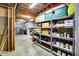 Unfinished basement with shelving units, storage bins, exposed ceiling, and concrete floor at 5521 Salem N Dr, Carmel, IN 46033