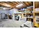 Unfinished basement featuring exposed ceiling, storage shelves, and concrete flooring at 5521 Salem N Dr, Carmel, IN 46033