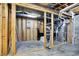 Unfinished basement space with exposed ceiling, utilities, and visible framework at 5521 Salem N Dr, Carmel, IN 46033