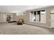 Basement includes walkout access, plush carpet, neutral walls, and rec area at 5521 Salem N Dr, Carmel, IN 46033
