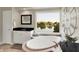 Elegant bathroom featuring a soaking tub with a scenic lake view and large decorative clock at 5521 Salem N Dr, Carmel, IN 46033