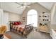 Charming bedroom featuring a large arched window and quaint decor at 5521 Salem N Dr, Carmel, IN 46033