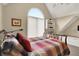 Bright bedroom with a cozy bed, complemented by a window and built-in shelving at 5521 Salem N Dr, Carmel, IN 46033