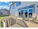 Exterior of home, showcasing a wood deck with outdoor seating and sliding glass doors at 5521 Salem N Dr, Carmel, IN 46033