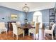 Formal dining room featuring hardwood floors, elegant chandelier, and sophisticated decor for a comfortable space at 5521 Salem N Dr, Carmel, IN 46033