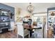 Well decorated dining area with blue accent wall, ornate chandelier, with views of stairs and kitchen area at 5521 Salem N Dr, Carmel, IN 46033