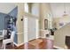 Bright entryway with high ceilings, hardwood floors, and decorative glass block sidelights at the door at 5521 Salem N Dr, Carmel, IN 46033