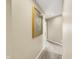 Neutral colored hallway with art on the wall and carpeted floor at 5521 Salem N Dr, Carmel, IN 46033
