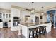Modern kitchen features granite counters, white cabinetry, and stainless-steel appliances for a contemporary living space at 5521 Salem N Dr, Carmel, IN 46033