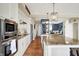 Spacious kitchen with granite countertops, stainless steel appliances, and open layout leading to a cozy living space at 5521 Salem N Dr, Carmel, IN 46033