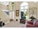 Spacious living room featuring large windows, hardwood floors, and comfortable seating at 5521 Salem N Dr, Carmel, IN 46033