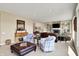 Inviting living room with comfortable seating, a cozy fireplace, and built-in shelves for decor at 5521 Salem N Dr, Carmel, IN 46033