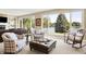 Bright and airy living room with large windows providing stunning lake views and comfortable seating at 5521 Salem N Dr, Carmel, IN 46033