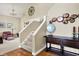 Comfortable living room with a carpet floor, elegant decor, and access to the staircase at 5521 Salem N Dr, Carmel, IN 46033