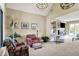 Elegant living room with high ceilings, large windows, built-in shelves, and comfortable seating at 5521 Salem N Dr, Carmel, IN 46033
